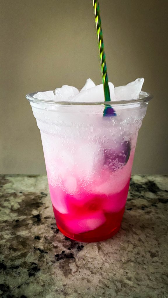 stirring pretty in pink drink